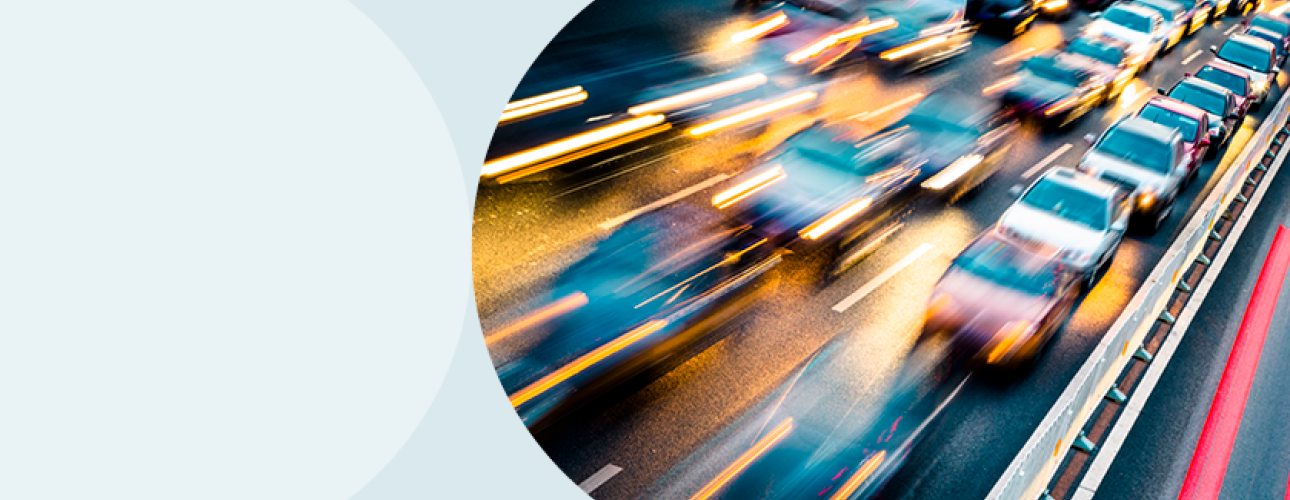 A slow-exposure decorative image of cars on a highway in the evening.